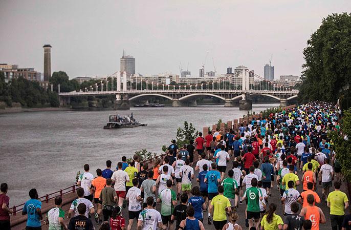 Runners embark on the 2017 London JPM Coporate Challenge beside the Thames River